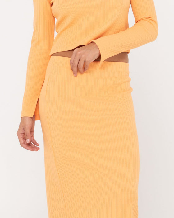 woman-wearing-scarlett-maxi-skirt-in-apricot-blush