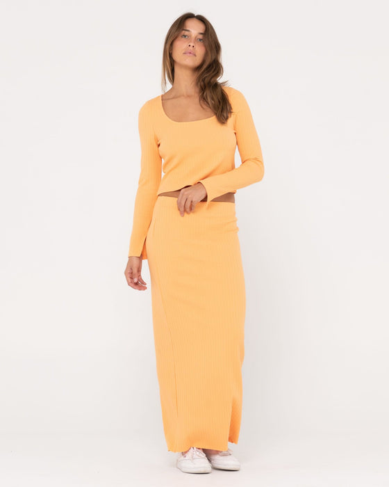 woman-wearing-scarlett-maxi-skirt-in-apricot-blush