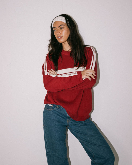 woman-wearing-white-lines-long-sleeve-crew-neck-knit-in-rhubarb