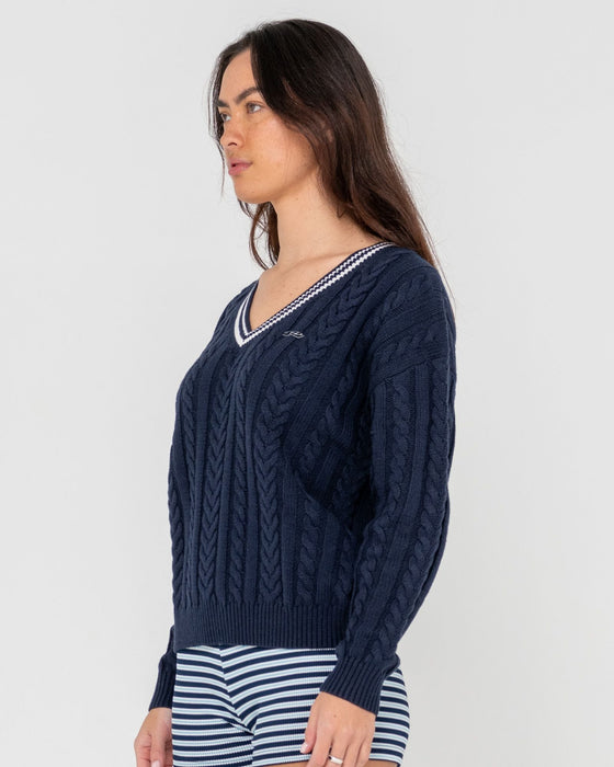 woman-wearing-oxford-oversized-vee-neck-knit-in-navy-blue