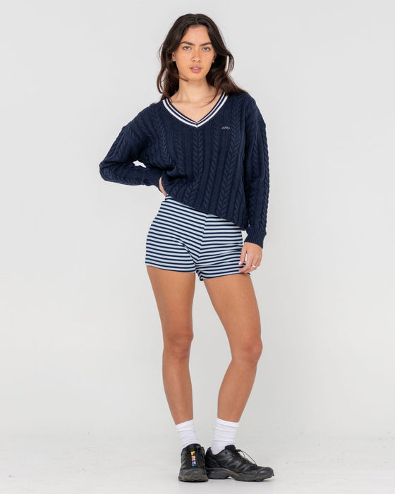 woman-wearing-oxford-oversized-vee-neck-knit-in-navy-blue