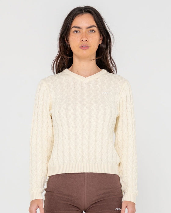 woman-wearing-collegiate-long-sleeve-vee-neck-knit-in-snow