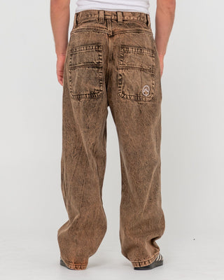 Man wearing R Dot Baggy Jean in Overdyed Brown