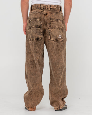 Man wearing R Dot Baggy Jean in Brown