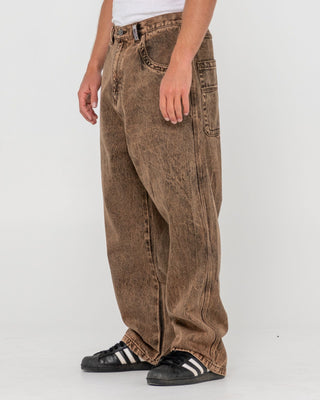 Man wearing R Dot Baggy Jean in Overdyed Brown