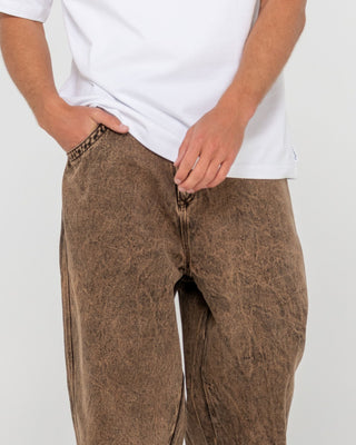 Man wearing R Dot Baggy Jean in Overdyed Brown