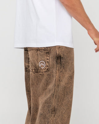 Man wearing R Dot Baggy Jean in Overdyed Brown