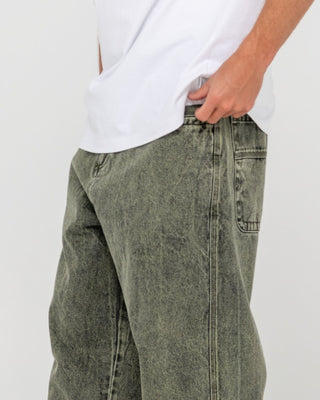 Man wearing R Dot Baggy Jean in Overdyed Green