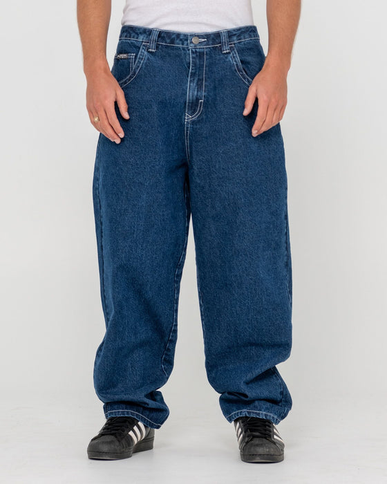 man-wearing-trusty-tapered-denim-jean-in-deep-sea-blue