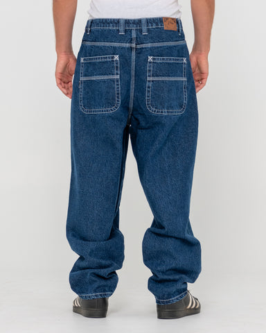 Man wearing Trusty Tapered Denim Jean in Blue