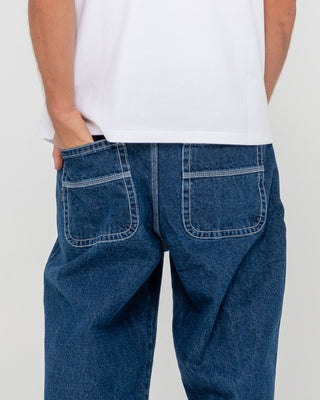 Man wearing Trusty Tapered Denim Jean in Deep Sea Blue