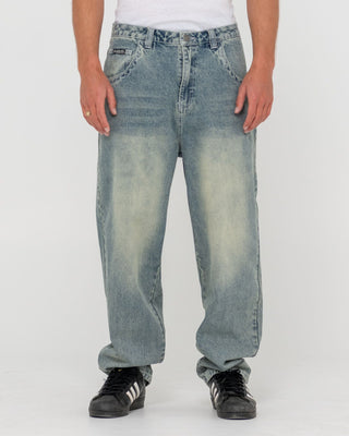 Man wearing Trusty Tapered Denim Jean in Dirty Dawg
