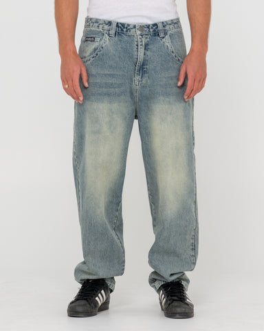 Man wearing Trusty Tapered Denim Jean in Blue