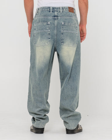 Man wearing Trusty Tapered Denim Jean in Blue