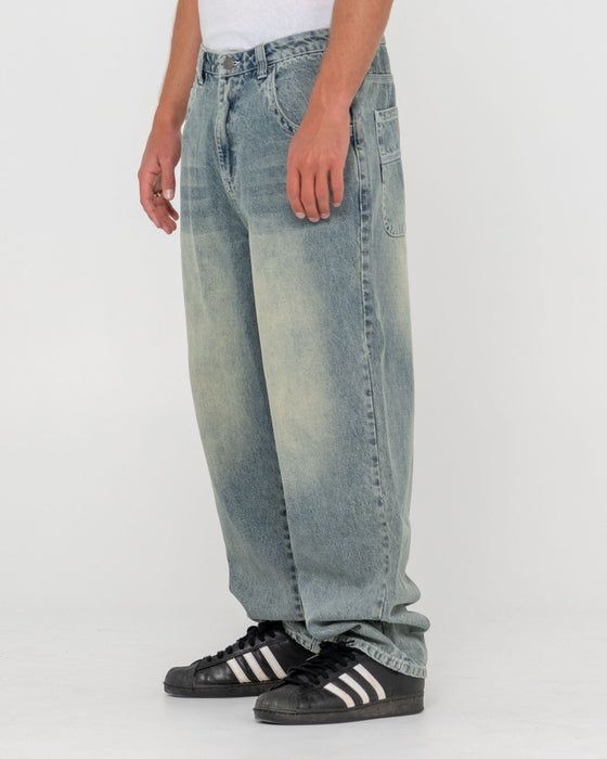 man-wearing-trusty-tapered-denim-jean-in-dirty-dawg