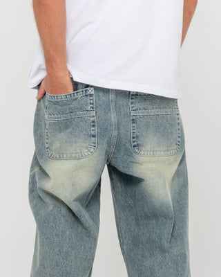 Man wearing Trusty Tapered Denim Jean in Dirty Dawg