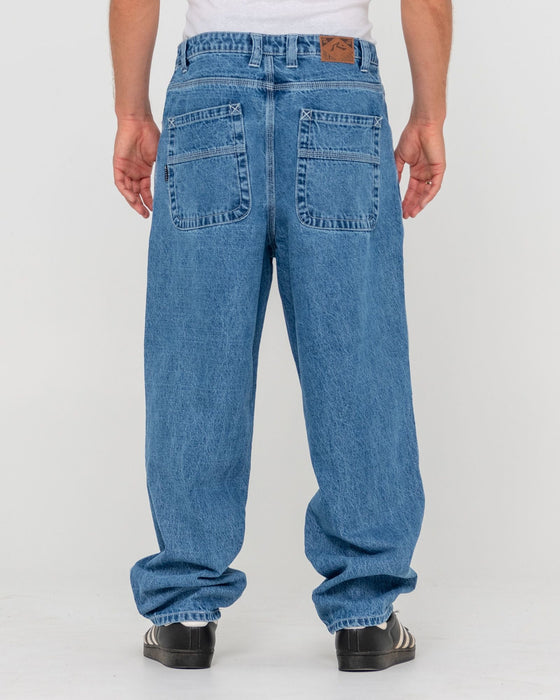 man-wearing-trusty-tapered-denim-jean-in-middy-blue