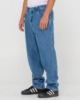 Man wearing Trusty Tapered Denim Jean in Middy Blue