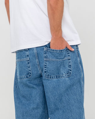 Man wearing Trusty Tapered Denim Jean in Middy Blue