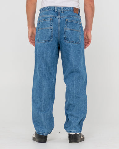 Man wearing Lucifer Loose Jean - Middy Blue in Blue