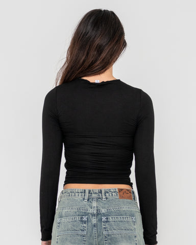 Woman wearing Plain Jane Ruched Long Sleeve Top in Black