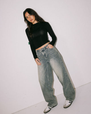 Woman wearing Plain Jane Ruched Long Sleeve Top in Black