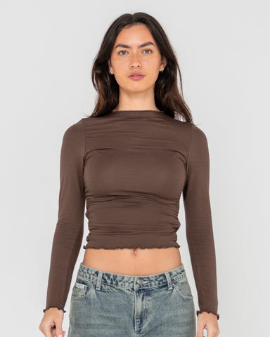 Woman wearing Plain Jane Ruched Long Sleeve Top in Brown