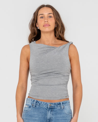 Woman wearing Nightfall Asymmetric Skimmer Top in Brown