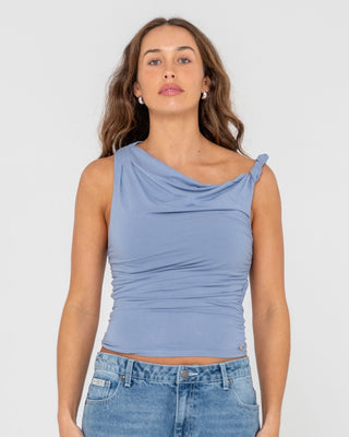 Woman wearing Nightfall Asymmetric Skimmer Top in Glacier Lake