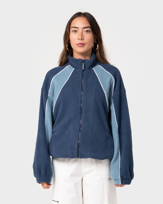 Woman wearing Two Tides Zip Through Sherpa Fleece in Atlantic Blue