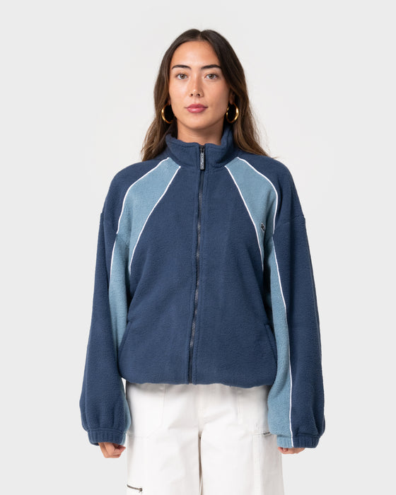 woman-wearing-two-tides-zip-through-sherpa-fleece-in-atlantic-blue