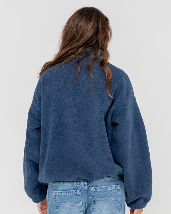 woman-wearing-two-tides-zip-through-sherpa-fleece-in-atlantic-blue