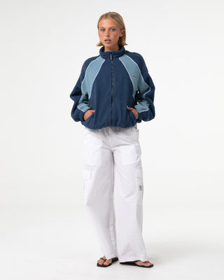 Woman wearing Two Tides Zip Through Sherpa Fleece in Atlantic Blue