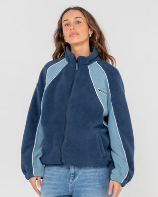 Woman wearing Two Tides Zip Through Sherpa Fleece in Atlantic Blue