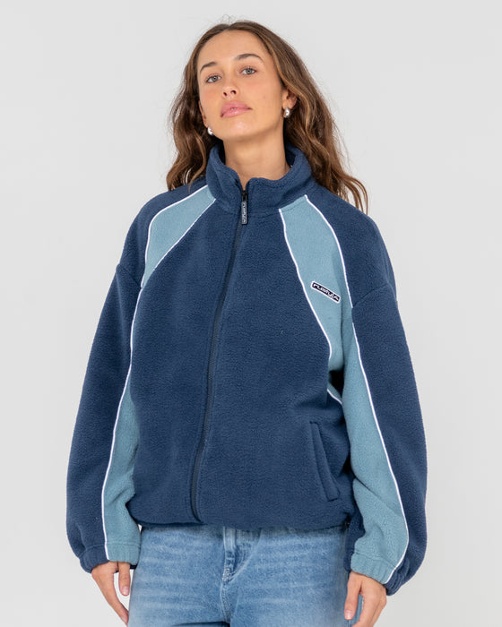 woman-wearing-two-tides-zip-through-sherpa-fleece-in-atlantic-blue