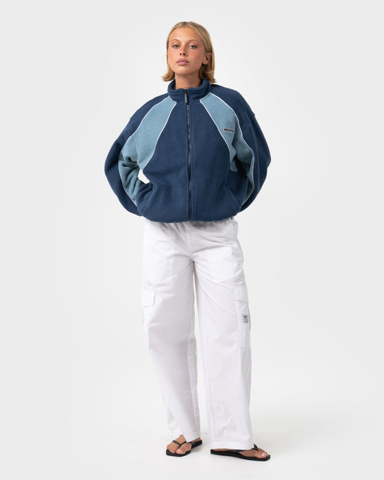 woman-wearing-two-tides-zip-through-sherpa-fleece-in-atlantic-blue