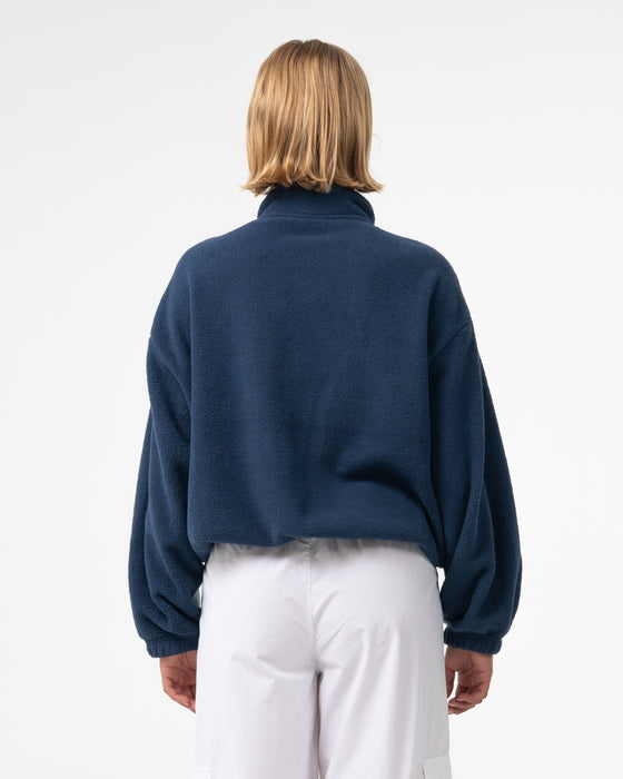 woman-wearing-two-tides-zip-through-sherpa-fleece-in-atlantic-blue