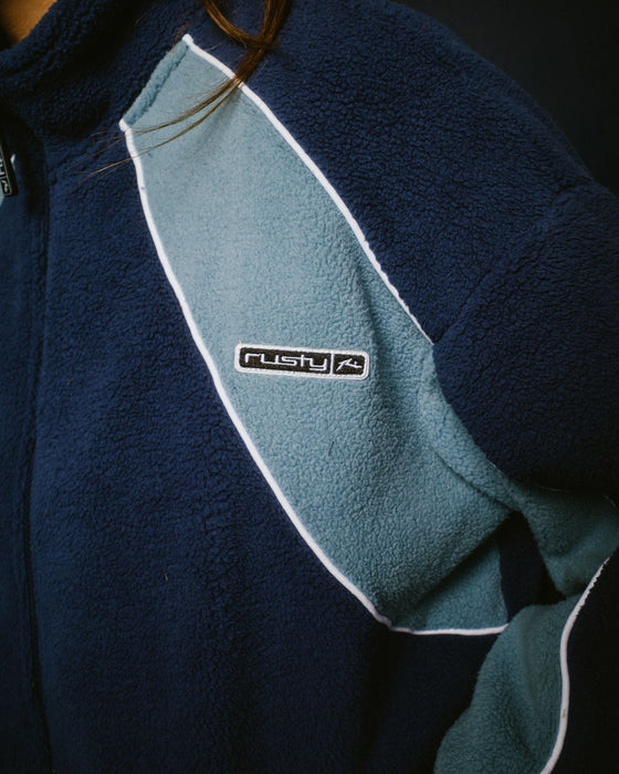 woman-wearing-two-tides-zip-through-sherpa-fleece-in-atlantic-blue