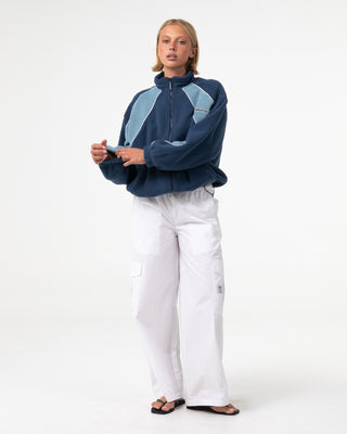 Woman wearing Two Tides Zip Through Sherpa Fleece in Atlantic Blue