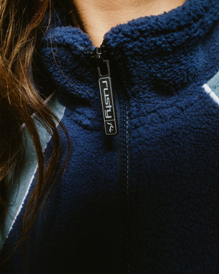 Woman wearing Two Tides Zip Through Sherpa Fleece in Atlantic Blue