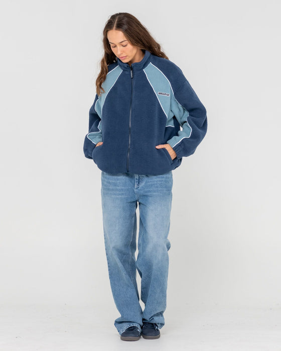 woman-wearing-two-tides-zip-through-sherpa-fleece-in-atlantic-blue