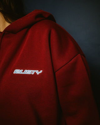 Woman wearing Flip Mommy Oversize Zip Hooded Fleece in Rhubarb