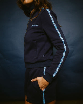 Woman wearing Midnights Long Sleeve Zip Through Fleece in Atlantic Blue
