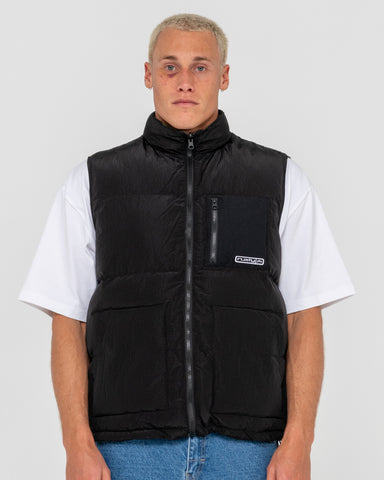 Man wearing Rippa Puffer Vest in Black