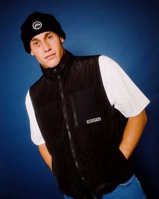 Man wearing Rippa Puffer Vest in Black