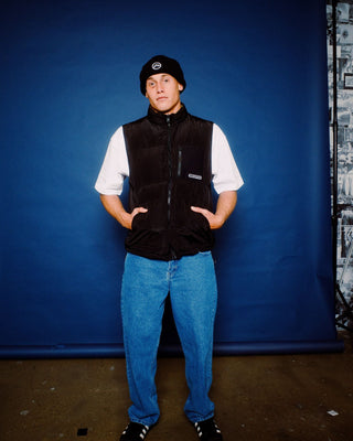 Man wearing Rippa Puffer Vest in Black