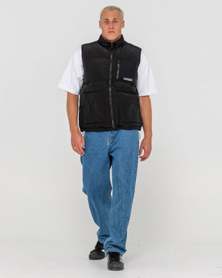 Man wearing Rippa Puffer Vest in Black