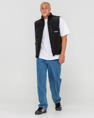 Man wearing Rippa Puffer Vest in Black