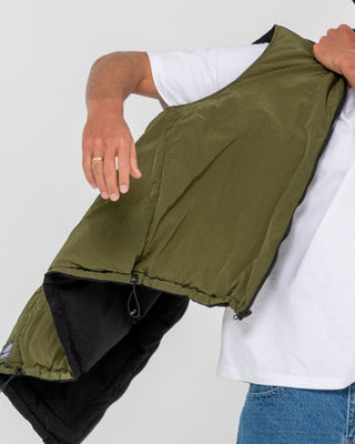 Man wearing Rippa Puffer Vest in Black