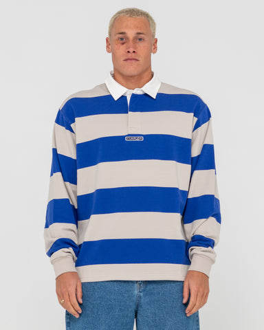 Man wearing Wilk Long Sleeve Rugby in Blue